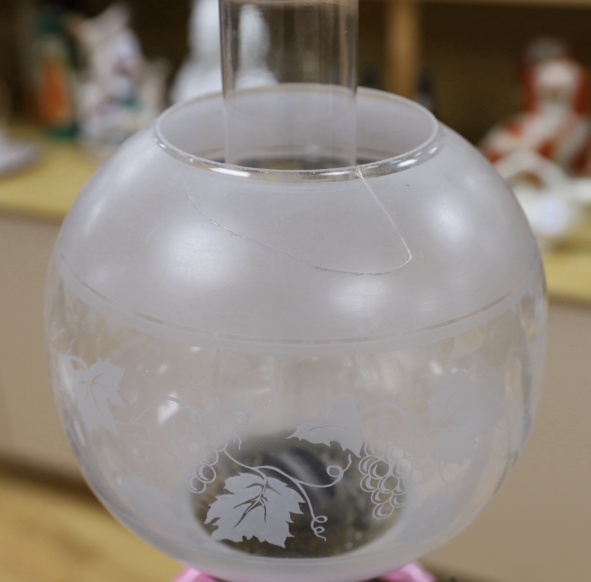 A late 19th century pink and white glass oil lamp, 73cm high